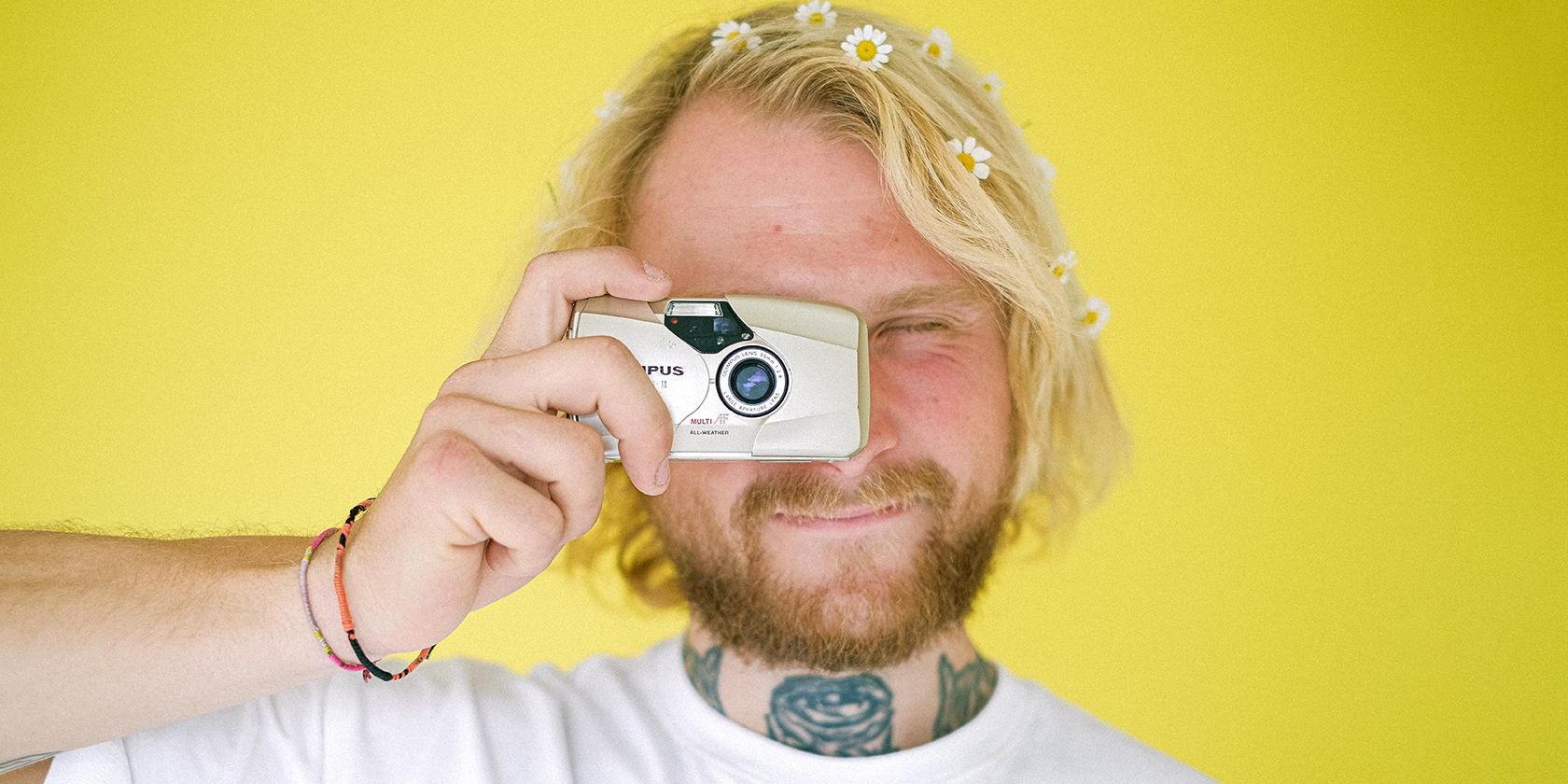 Cover man taking picture with point and shoot