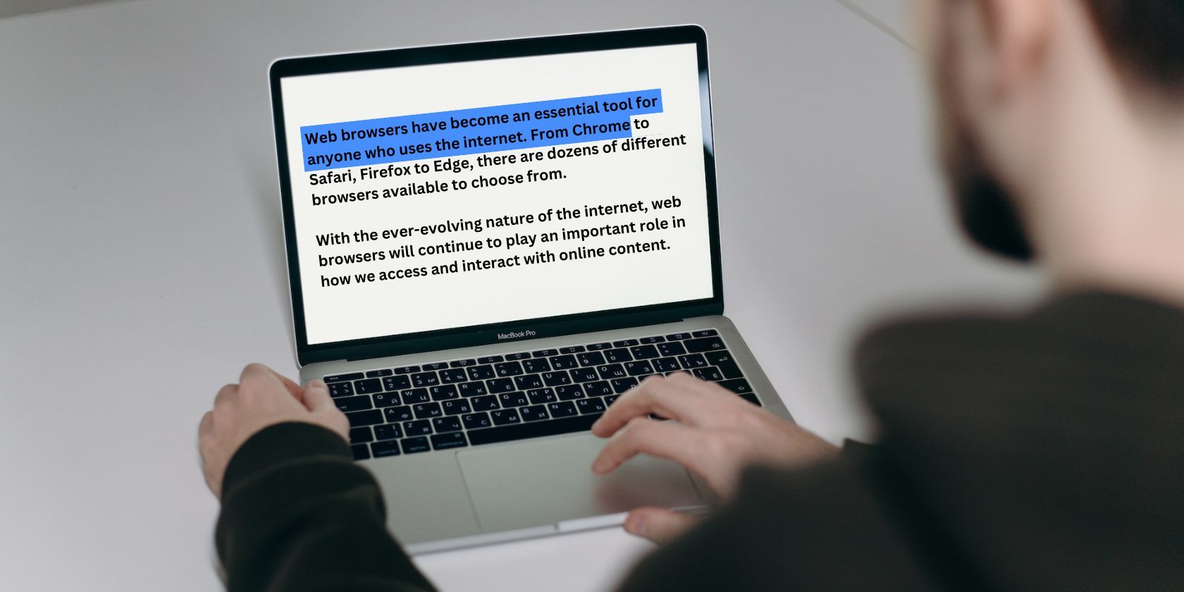 Man highlighting text on a Laptop