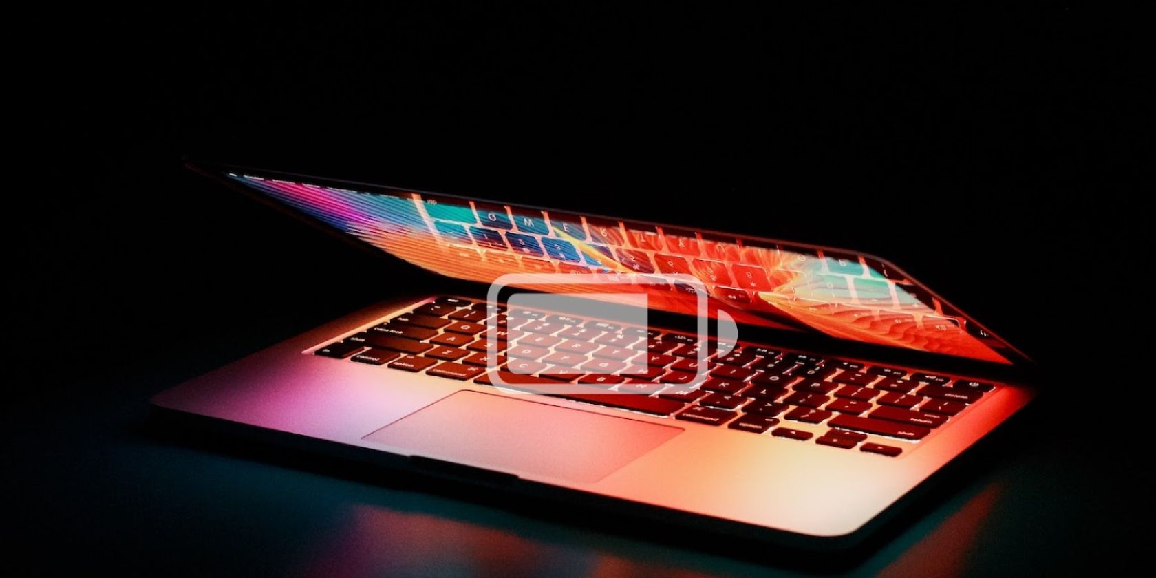 Open MacBook with battery icon superimposed
