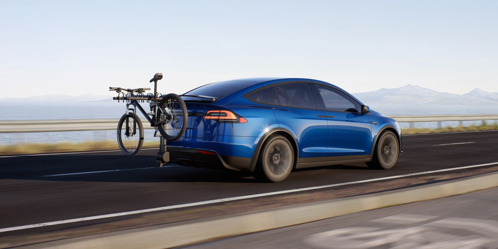 Xe điện và xe động cơ đốt trong: Loại nào tốt hơn ở độ cao? The Tesla Model X with a bike attachment at the rear feature