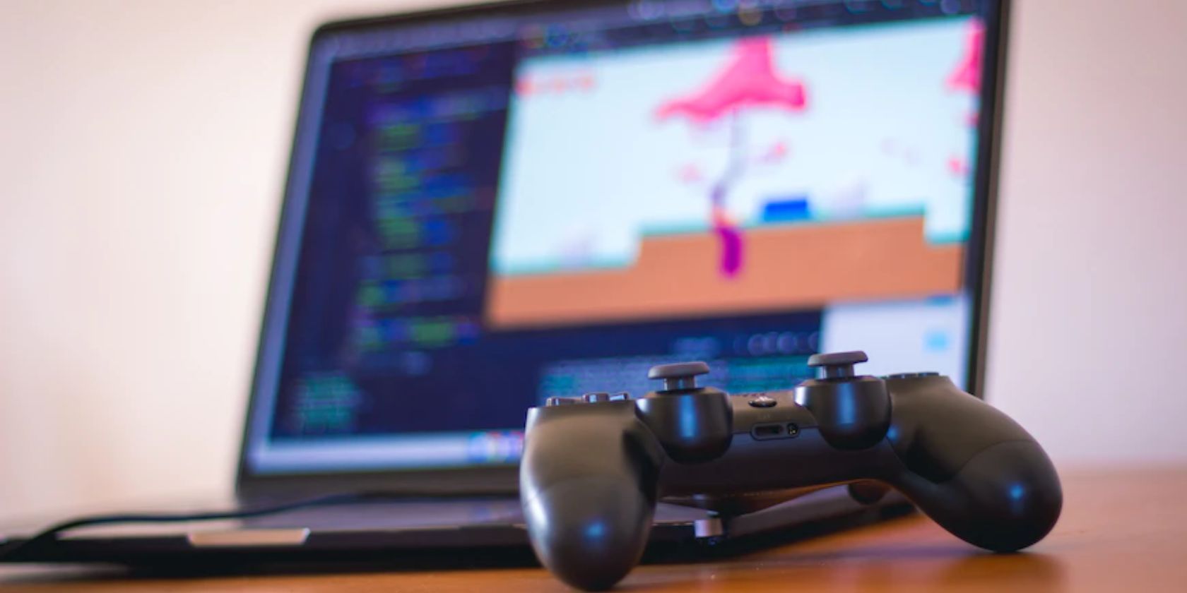 game controller in front of a laptop