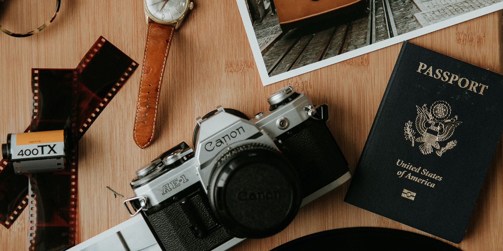 US passport with Canon film camera and film strip.