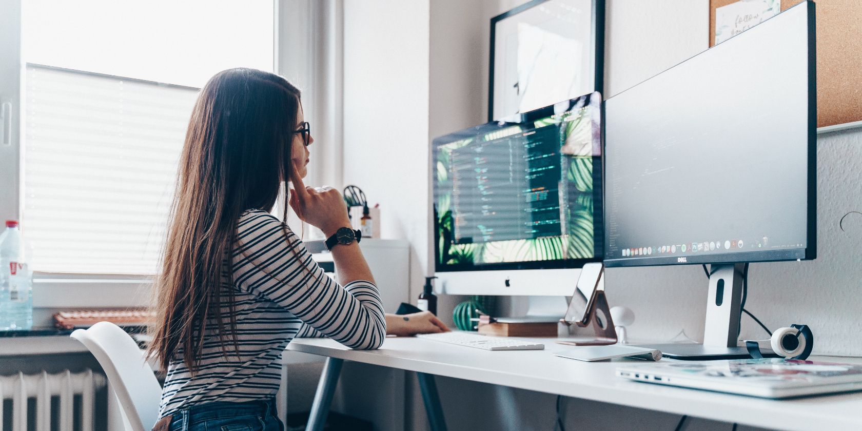Girl thinking near computer