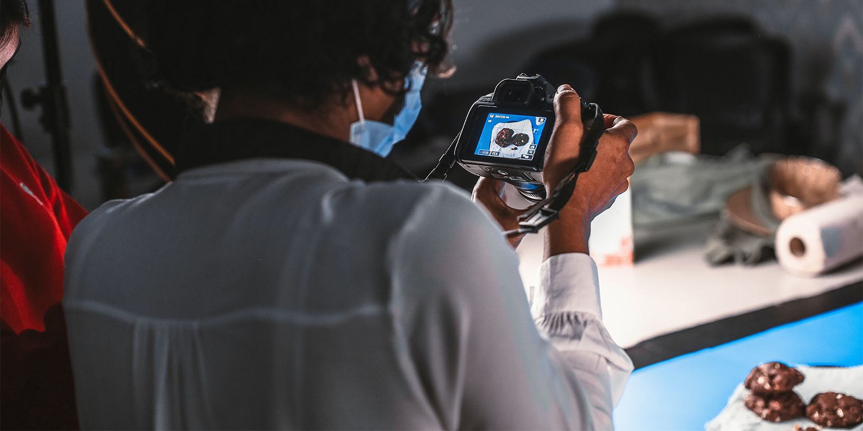 Photographer photographing a tray of cookies