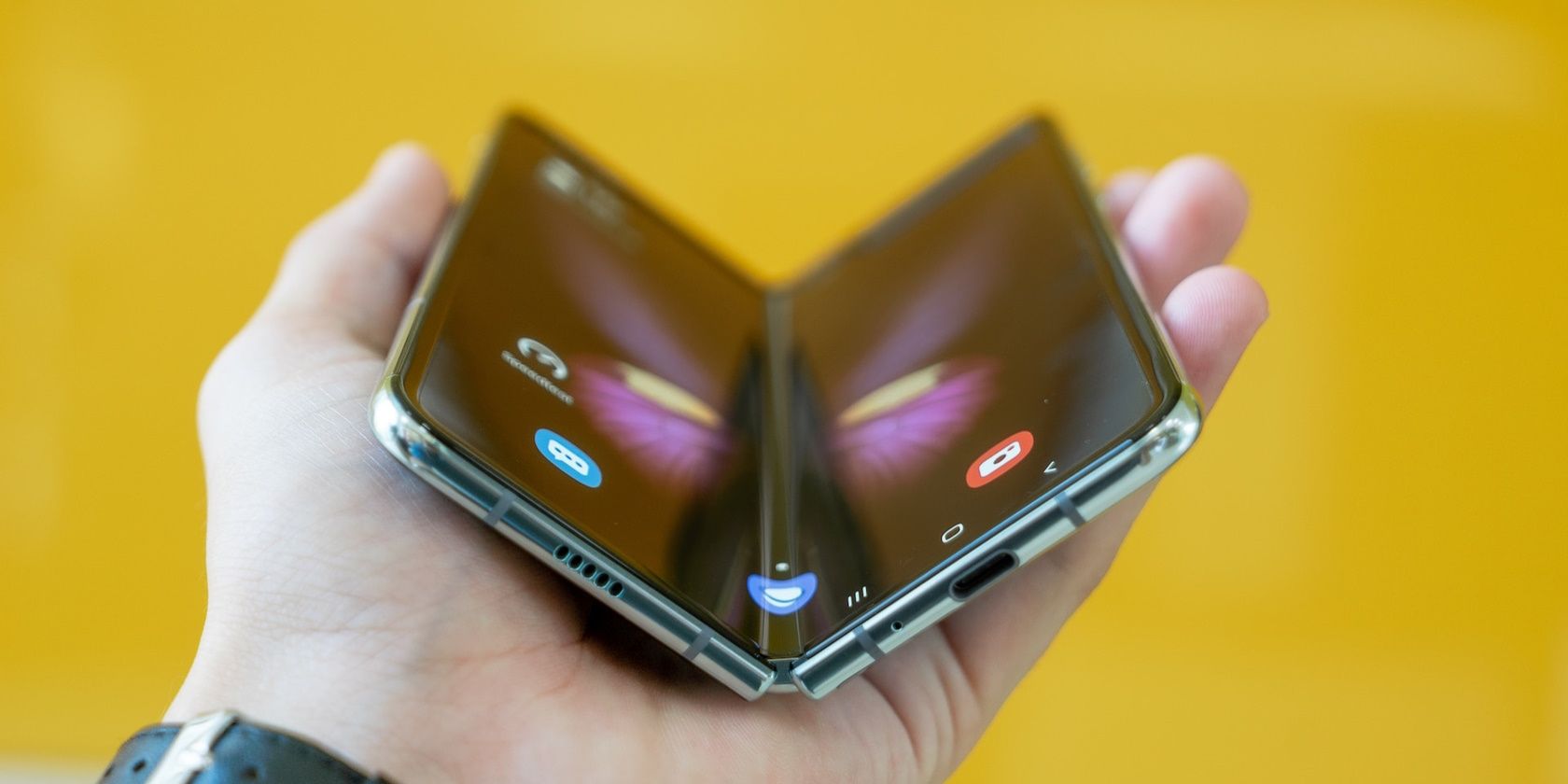 A hand holding a Samsung Galaxy Fold