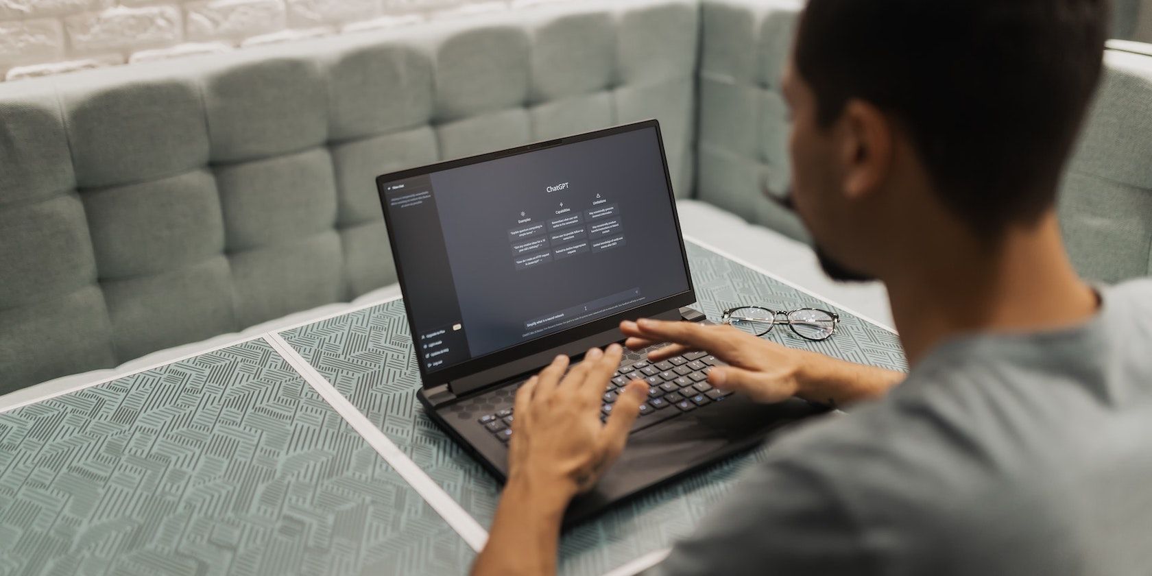 Person Using the ChatGPT Website on his Laptop