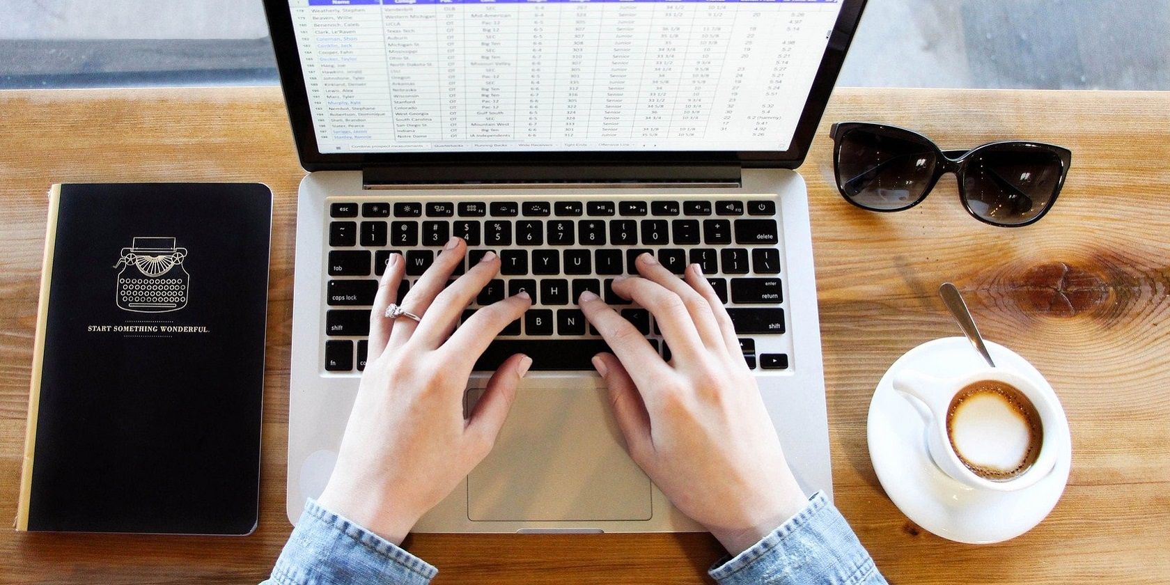 Cách sắp xếp theo ngày trong Excel Woman working with Spreadsheet on Laptop