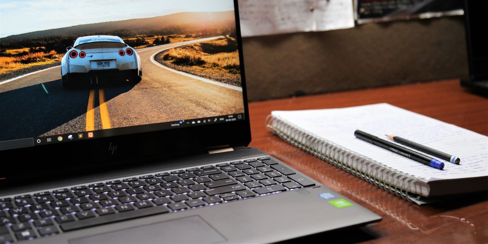 A black Windows laptop on a wooden table