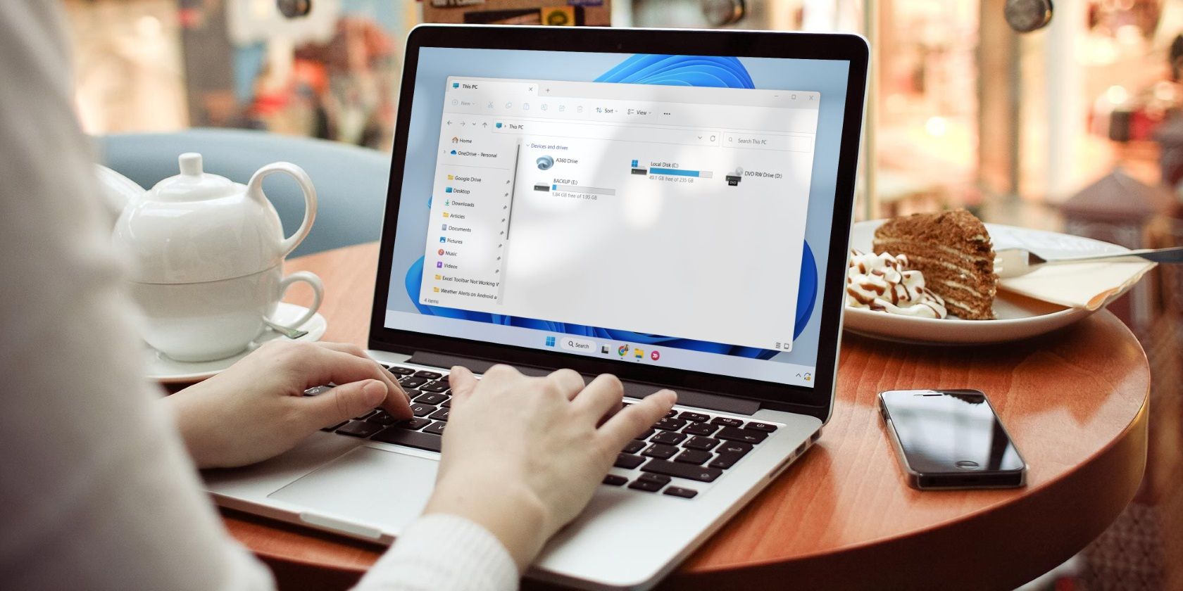 A woman using a Windows laptop