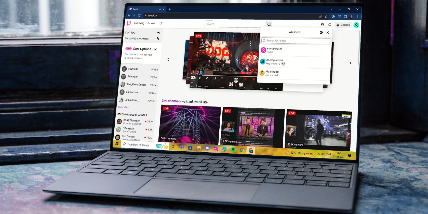 Twitch Site Open on Laptop Screen Showing Whisper History