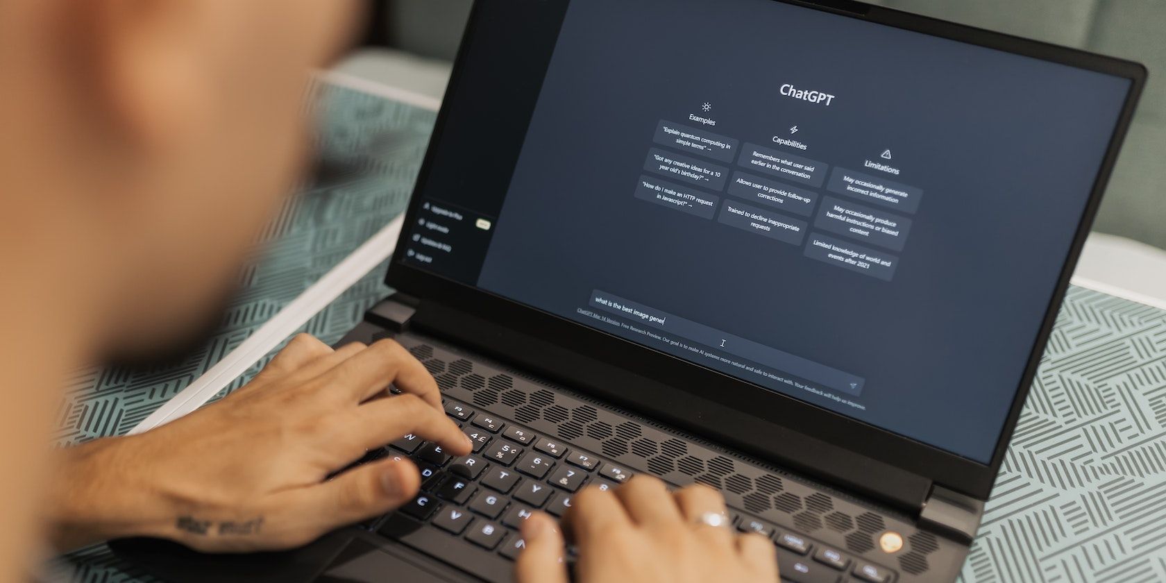person using chatGPT on laptop