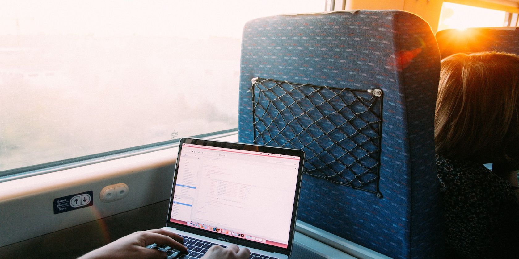 man working during a train travel