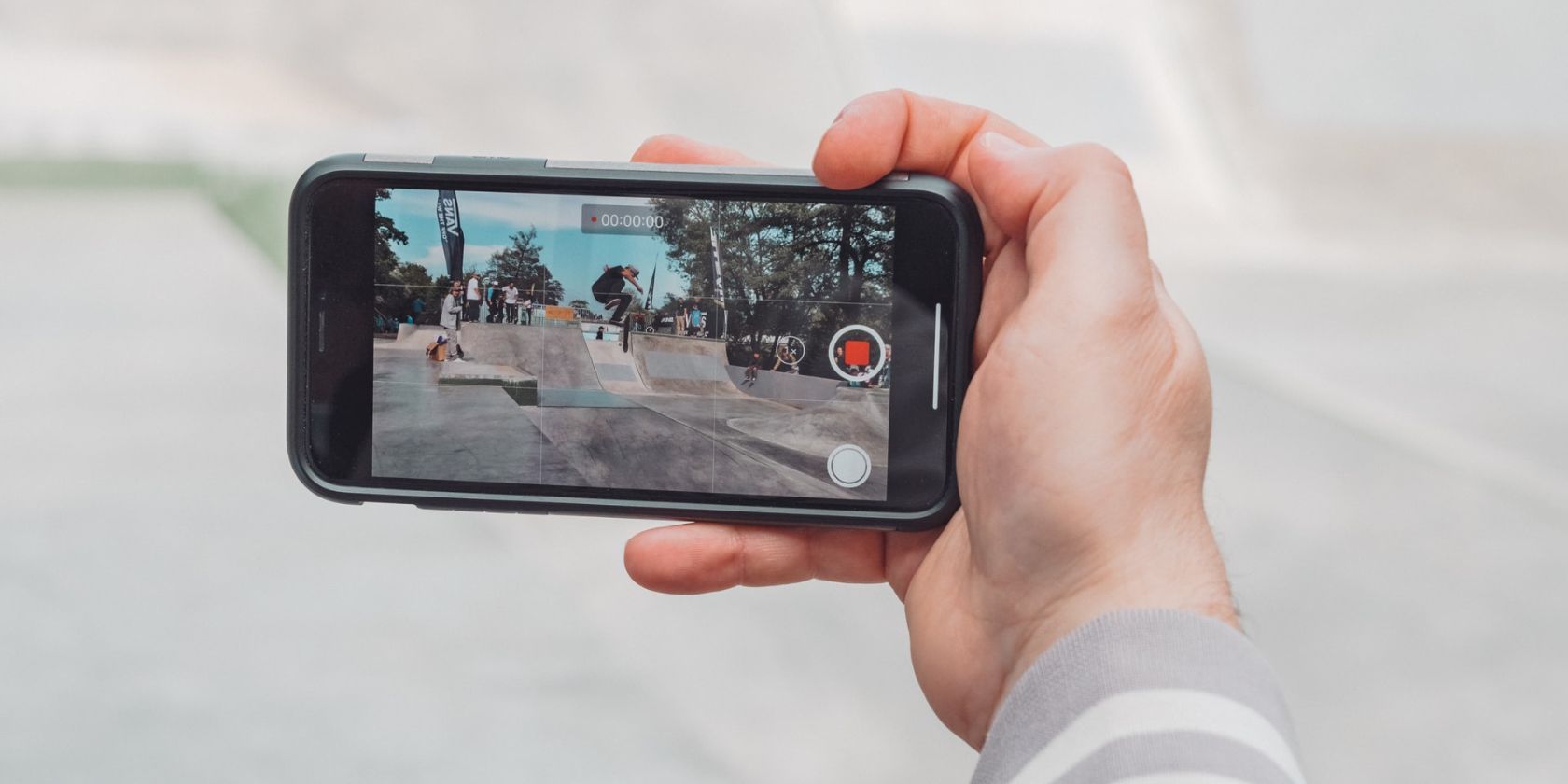 Person shooting a video using an iPhone