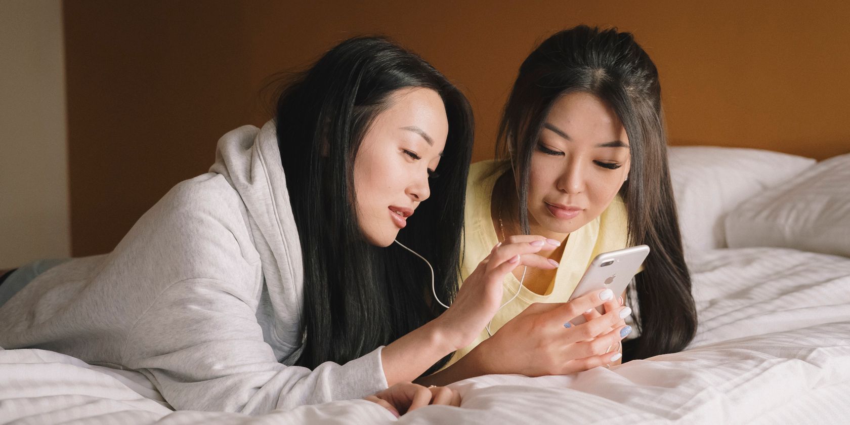 Two women looking at an iPhone together