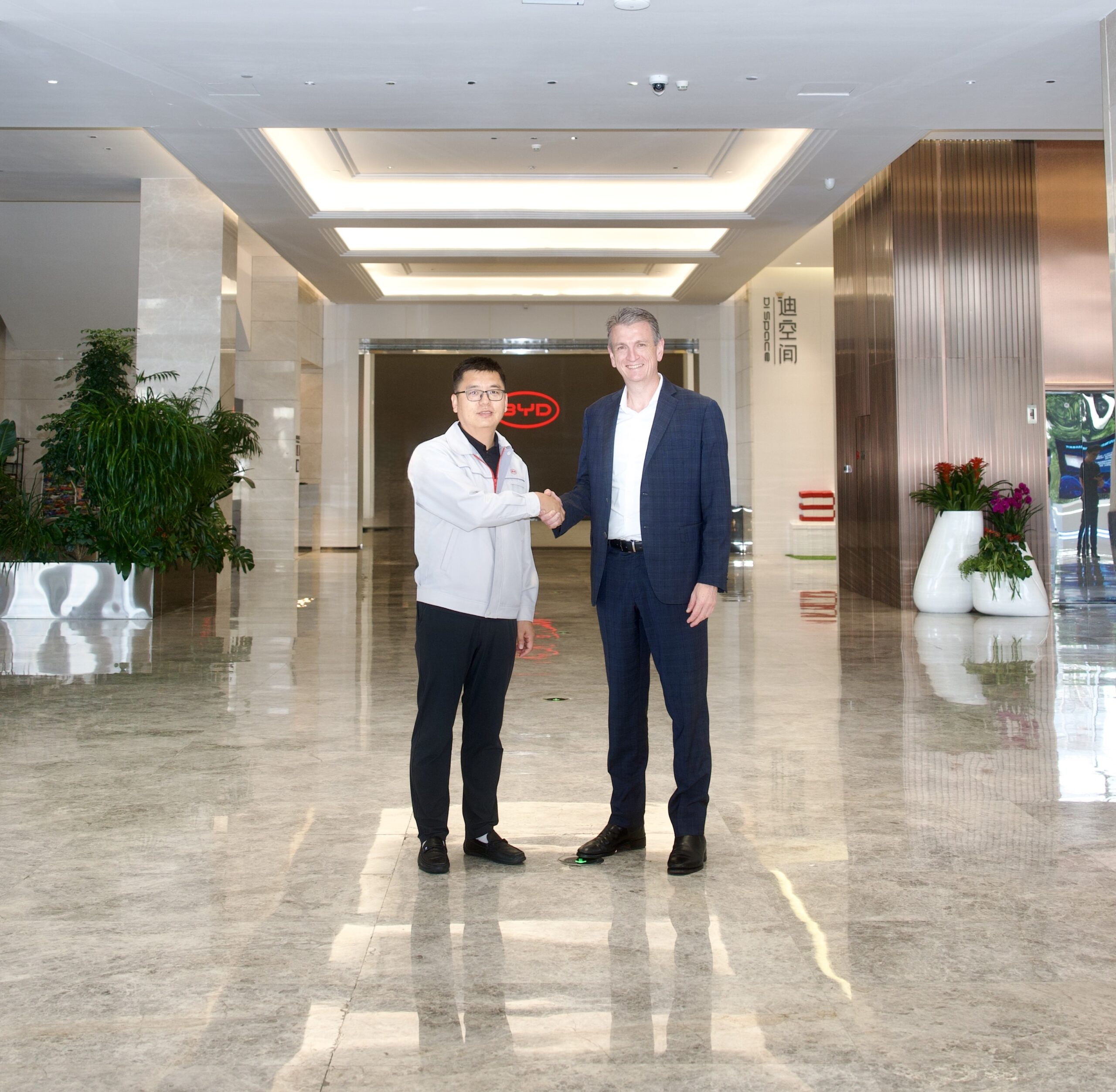 BYD Australia and Smart partner to make EVs more affordable for Australians Mr Wang Ping and Mr Scott Wharton shaking hands at the BYD facility in Shenzhen.